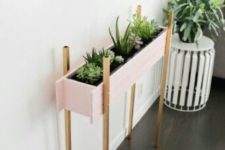 08 such a stylish blush planter on metallic legs can accentuate the room