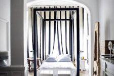 09 The bedroom is full of light, there’s a large frame bed placed under an arched ceiling
