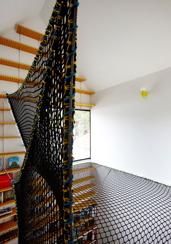 there are a lot of kids' zones in the house, including this one with steps and a net for fun
