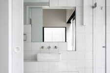 10 The bathroom is modern and chic, I love the geometry of mirrors here, they create a simple yet eye-catching accent