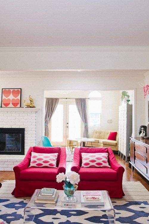fuchsia chairs brighten up this light-colored living room