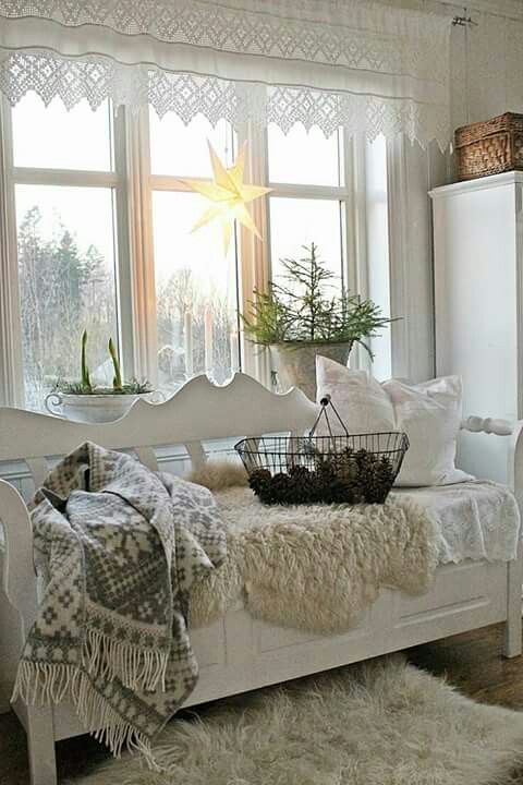a bench placed by the window can become a great place to relax