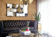 11 cork tile accent wall in the living room for a contrast with dark floors and a sofa