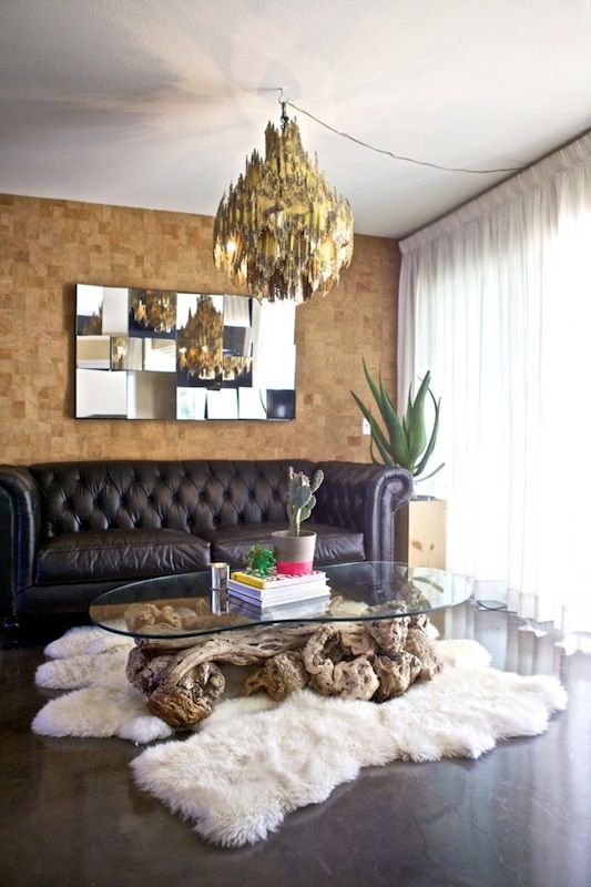 cork tile accent wall in the living room for a contrast with dark floors and a sofa