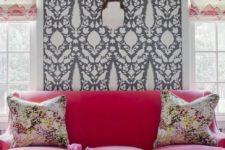 11 gorgeous fuchsia sofa in front of a patterned wall looks very bold
