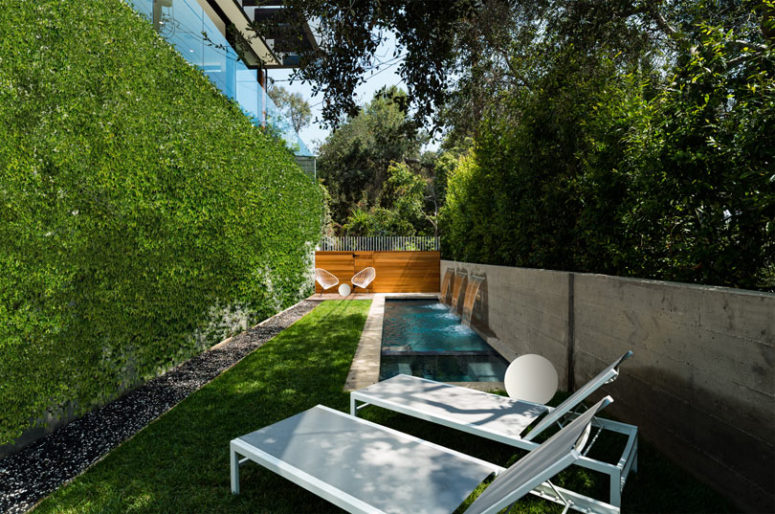 The walls are green and living ones to make the plunge pool feel like somewhere in a forest