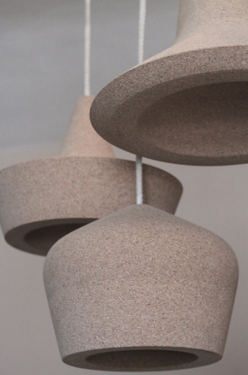 cork pendant lamps in different shapes look like a composition together