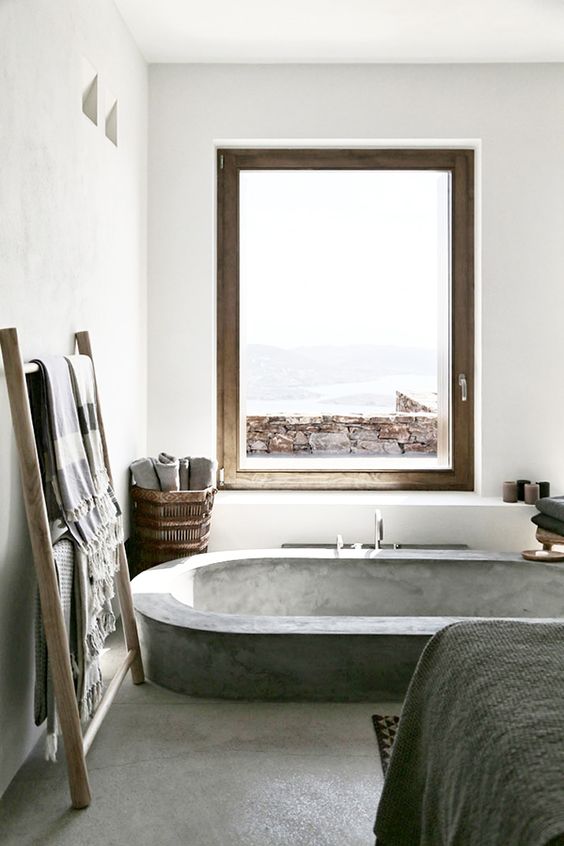 sunken concrete bathtub in the bedroom for a spa feel