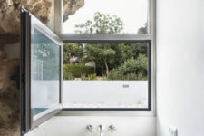 13 Bathroom overlooks the immediate green outdoors
