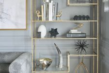 15 gold accent bookshelf and a picture frame in the same color