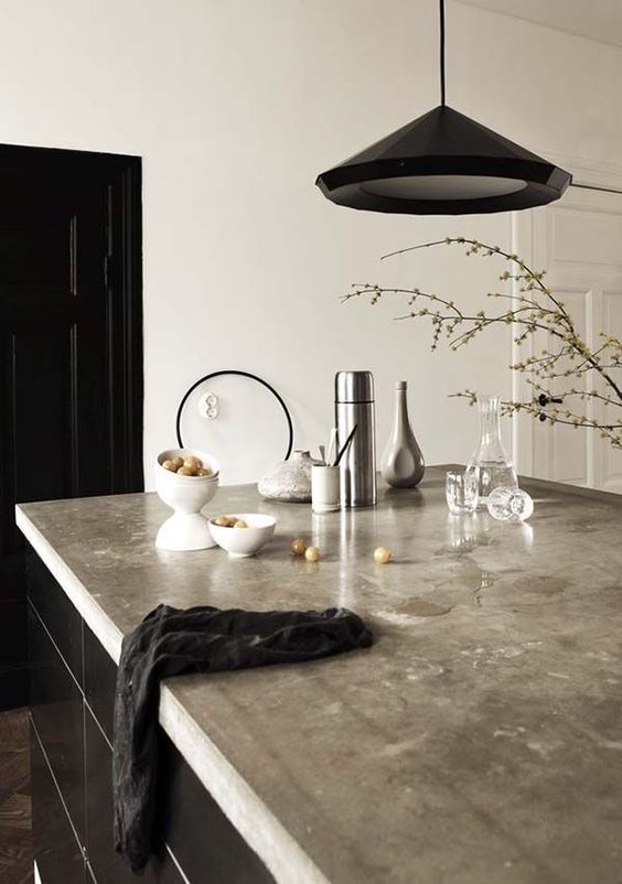 kitchen island with a polished concrete countertop