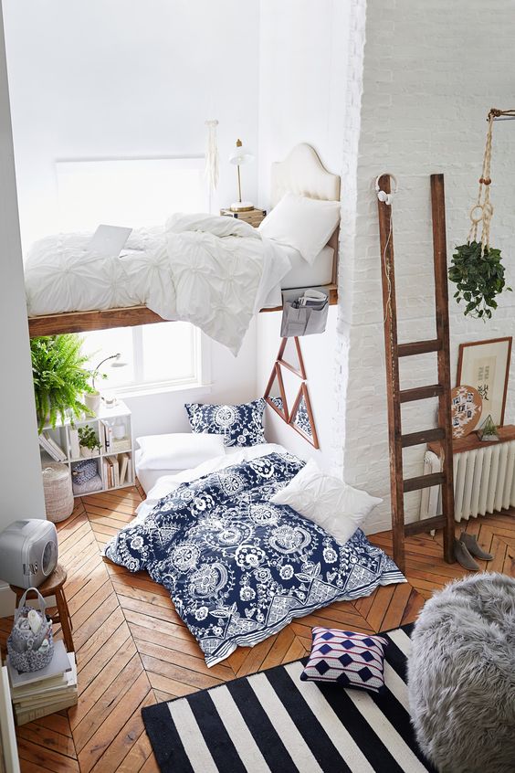 modern Scandi-inspired room with two sleeping spaces and textural textiles