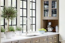 16 taupe kitchen with creay shades and brass handles looks chic