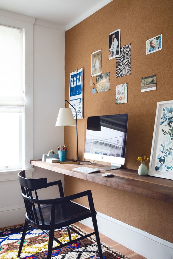 home office nook with a cork wall is an affordable and comfortable solution