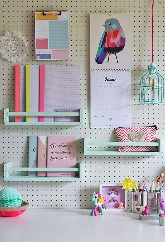 white pegboard with mint-colored shelves is great for a girlish space