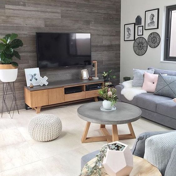 a concrete and wood coffee table and a TV unit covered with concrete