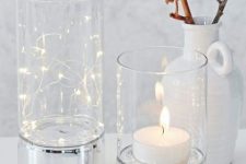 19 clear glass hurricanes with silver bases can add a cool touch to any decor