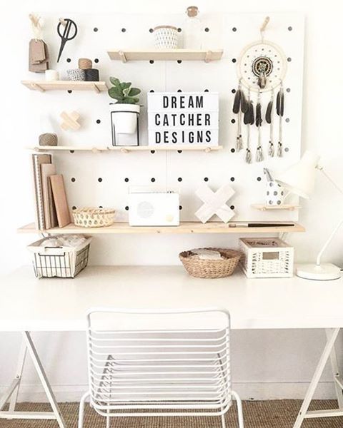 white pegboard with light-colored wooden shelves looks modern and refreshing