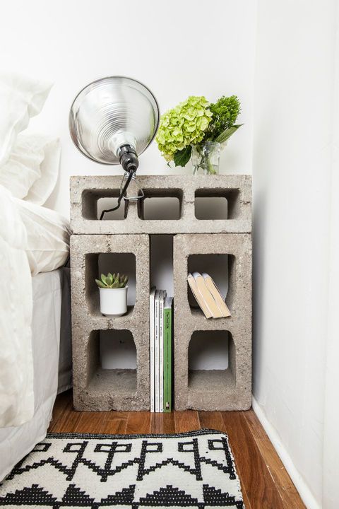 a nightstand made of concrete blocks looks rough and industrial