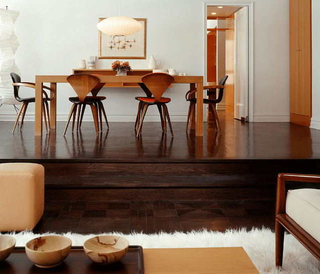 dark wooden floors with a raised level for accentuating the dining space