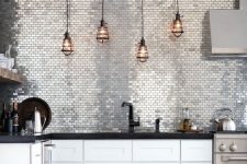 20 silver tiles and pipe lamp holder are to add a pretty textural touch here