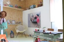 22 play space is accentuated with cork tiles on the walls and ceiling