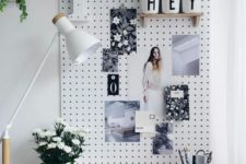 22 white pegboard with wooden shelves and to pin photos