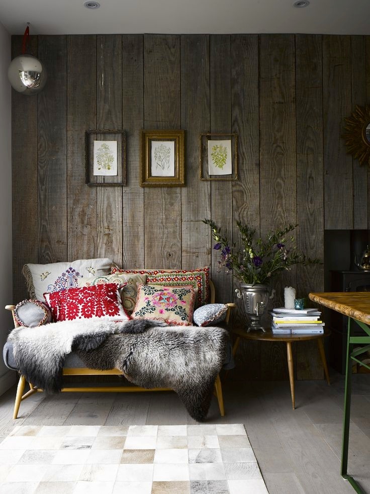 a weathered wood accent wall add a rustic feel and make the space unique