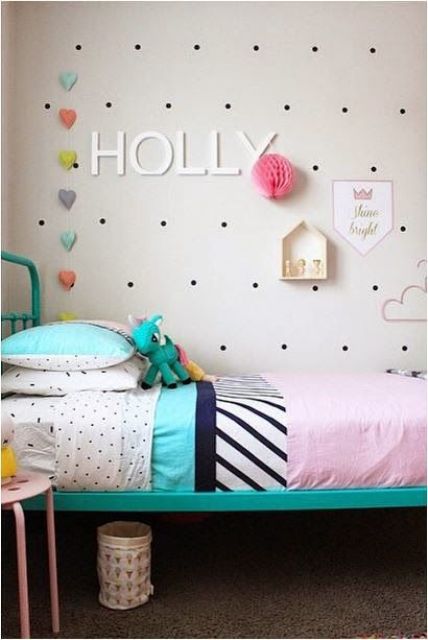 install a pegboard next to the bed to decorate the wall in a creative way and place some favorite toys