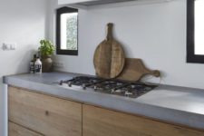 24 minimalist kitchen with concrete countertops and warm wood drawers
