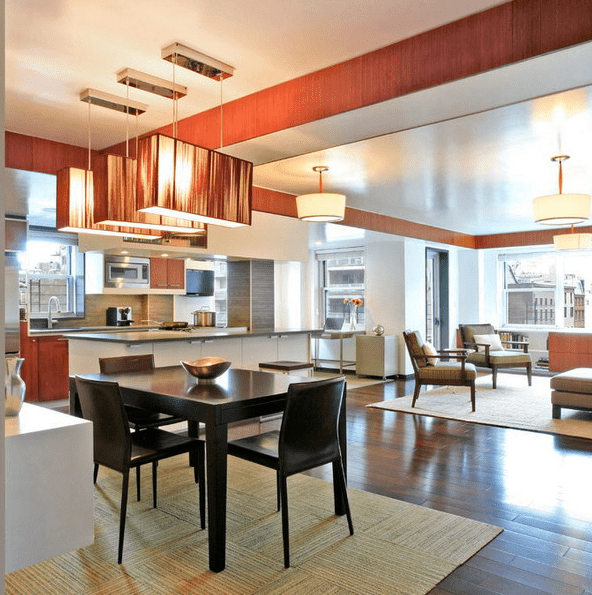 multi-level ceiling with various colors and lamps to separate the spaces