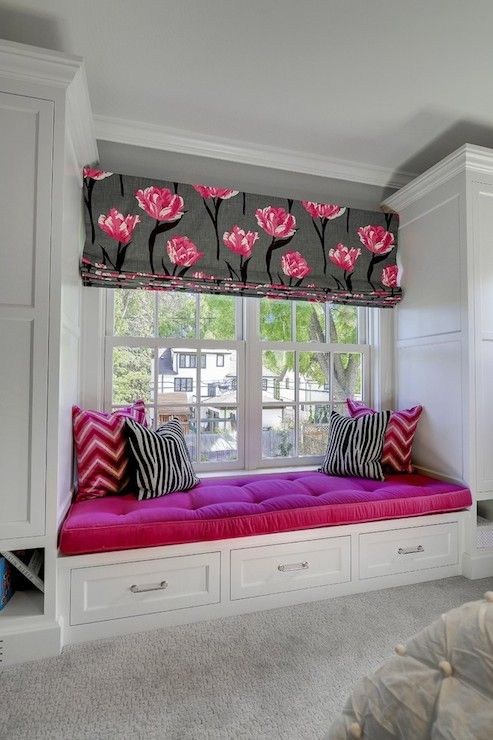 window sill nook with fuchsia upholstery in a girl's bedroom