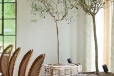 26 add a rustic touch to your dining space with trees in baskets