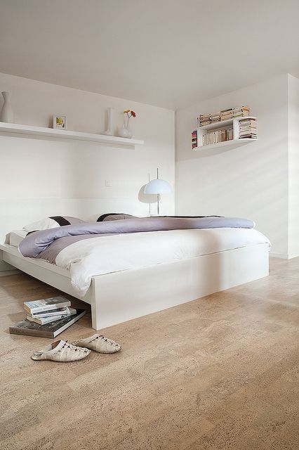Cork floors are eco friendly and look cool and warm, that's what you need for a bedroom