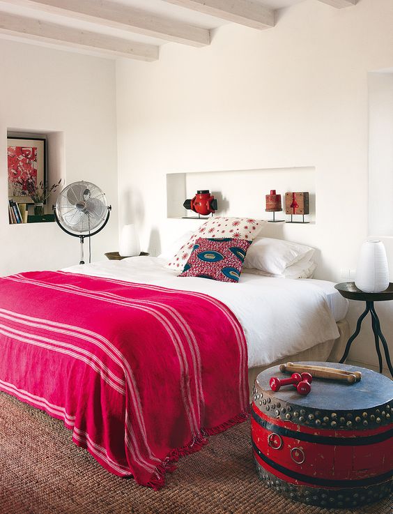 fuchsia blanket is a great idea for a boho-inspired bedroom