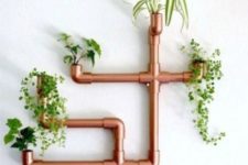 29 a steampunk or industrial interior will look great with a copper piping planter