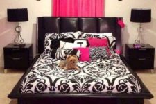 30 a fuchsia rug and a curtain headboard enliven the black and white space