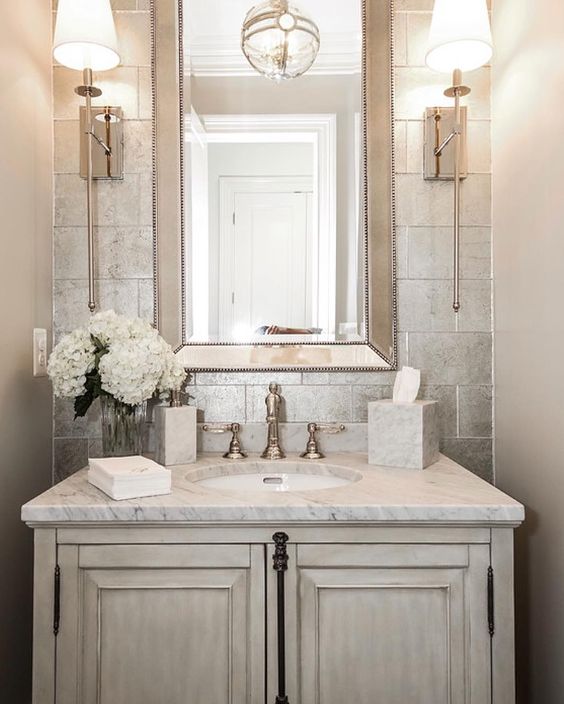 elegant powder room with a whitewashed wooden sink stand