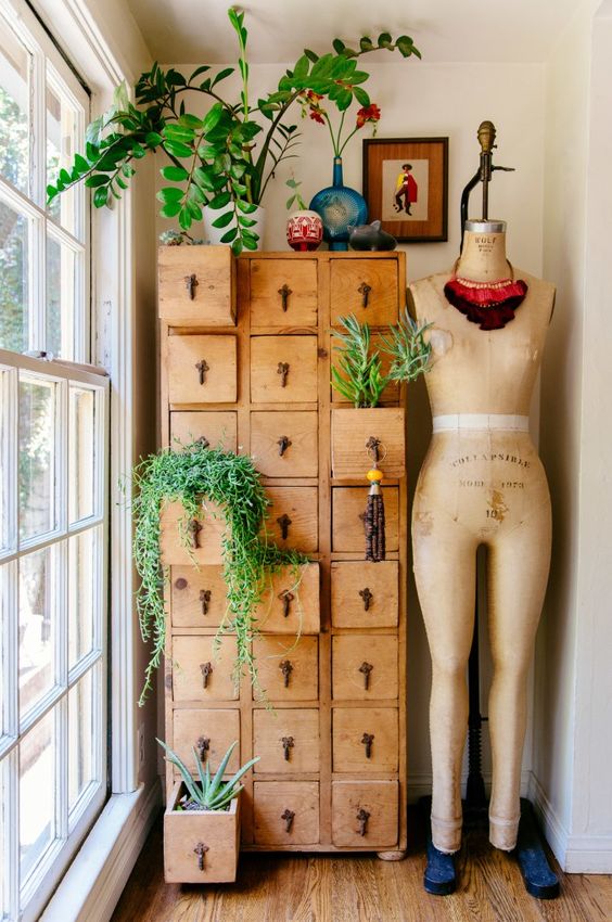 you can use a vintage dresser or apothecary piece for planting what you want