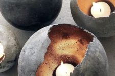 33 concrete spheres with metallics inside as candle holders