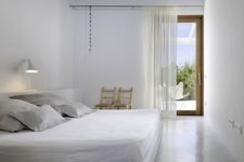 34 pure white bedroom with an accent concrete ceiling