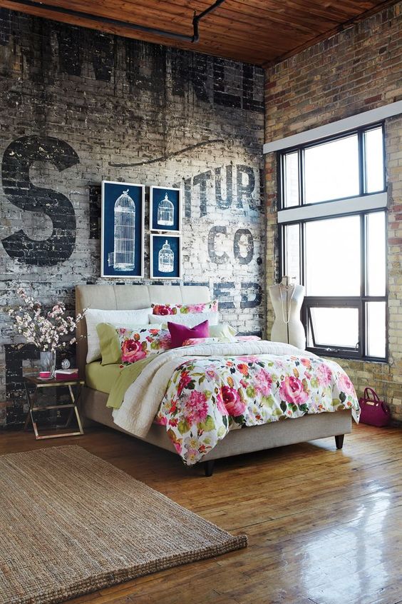 vintage industrial brick walls and contrasting decor for a bedroom