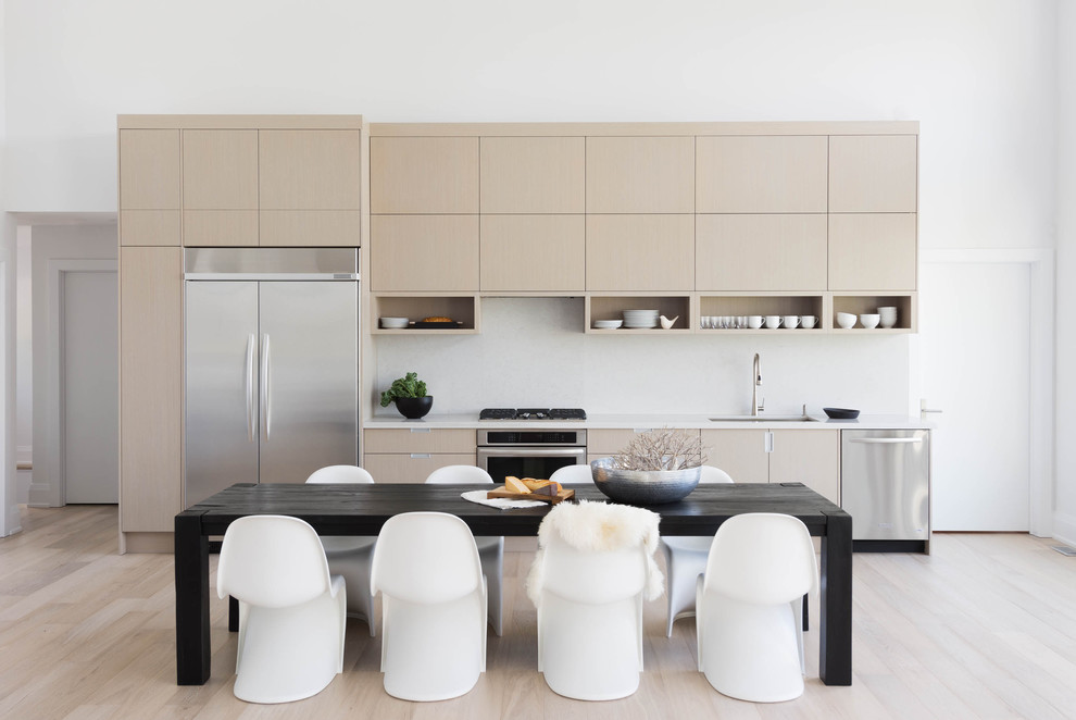 Even a modern and sleek kitchen can be designed in taupe shades. Although an addition of a black and white dining set is what makes this kitchen to stand out.  (Shirley Meisels)