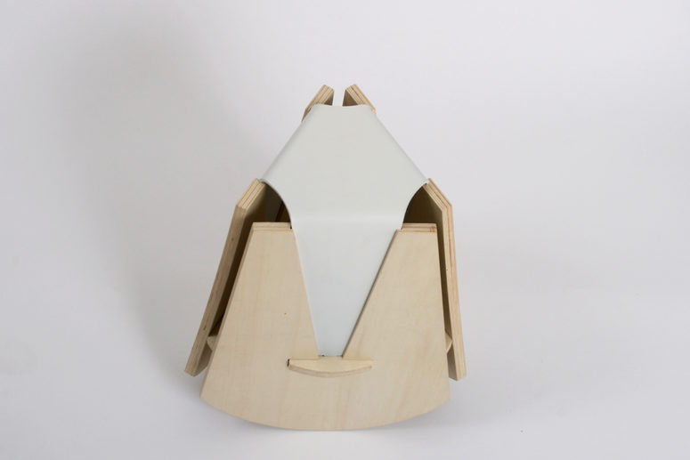The Geometric Stool is a unique piece made of light colored wood and leather with a creative modern design