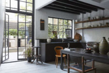 01 This moody kitchen decorted in industrial meets vintage style features a classic black and white color combo