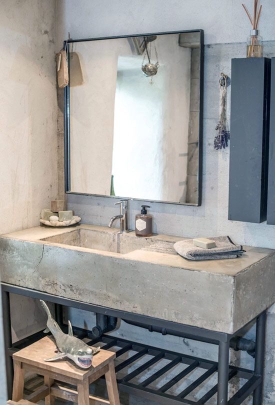 a concrete vanity on metal legs can be DIYed, and it will be very durable