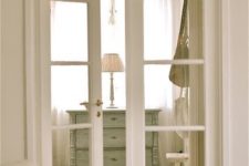 02 white French doors match a shabby chic interior and let ght light in