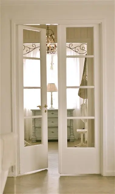 white French doors match a shabby chic interior and let ght light in