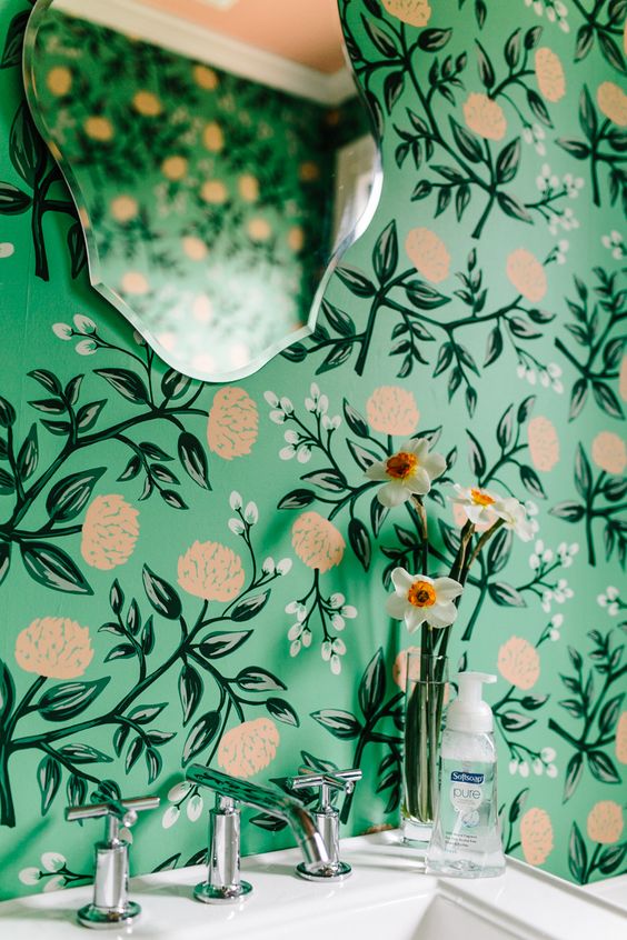 bold green wallpaper with botanical and floral prints for a girlish bathroom