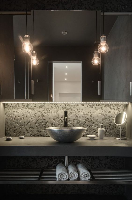 concrete and metal bathroom vanity with a stone sink and an open shelf